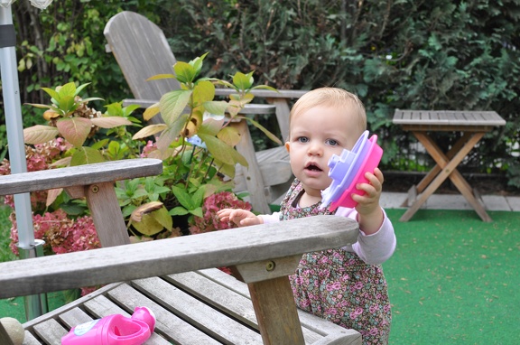 Playing with her boats